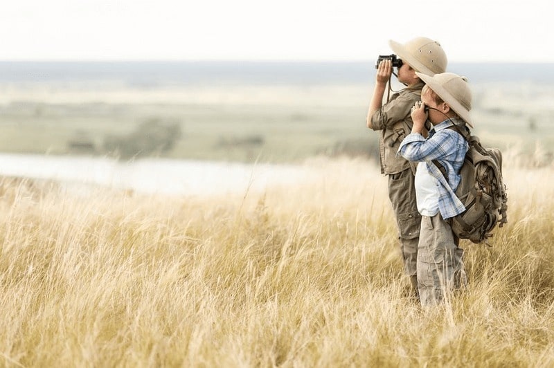 KT - 2 Kids on field looking far ahead