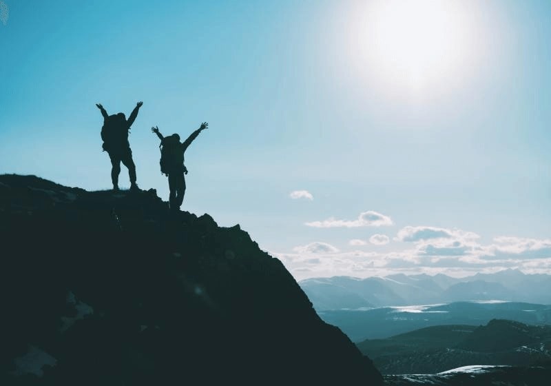 KT - People standing on mountain top