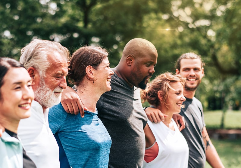 KT - Group of people standing shoulder to shoulder  