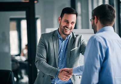 KT - Two businessman shaking hand