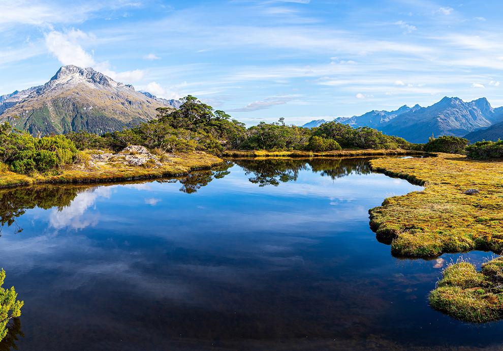Mountain lake surrounded by vibrant nature