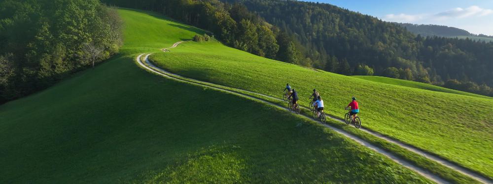 KT - People biking on a hill