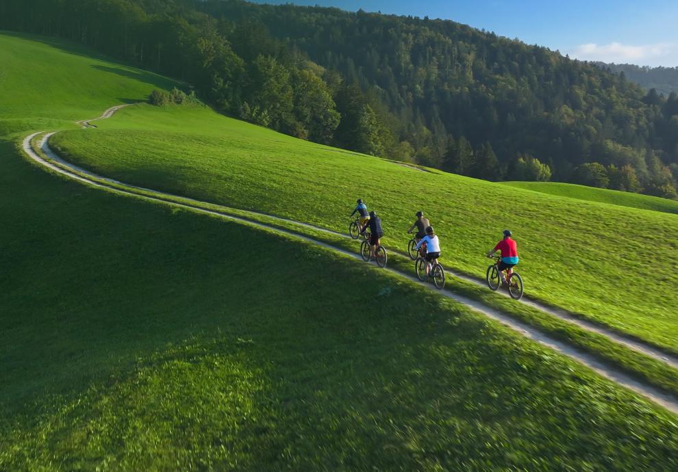 KT - People biking on a hill