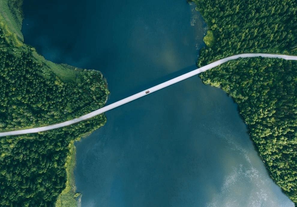 KT - Aerial View of Car driving on a bridge to another island